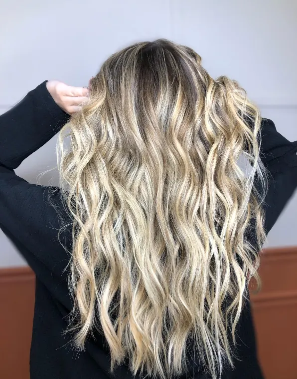 Soft blonde balayage with seamless dimension
