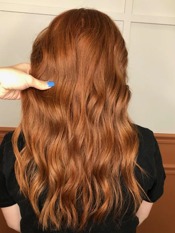 Rich copper hair color with a glossy finish